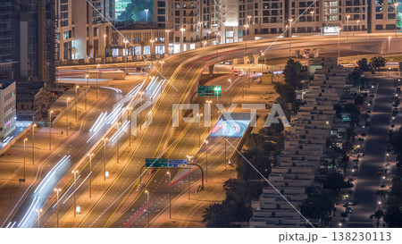 Traffic on the road in Jumeirah Lakes Towers district aerial night timelapse. Traffic on the road in Jumeirah Lakes Towers district aerial night timelapse. 138230113