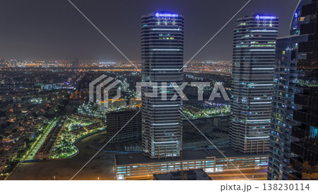 Jumeirah Lake Towers residential district aerial night timelapse near Dubai Marina Jumeirah Lake Towers residential district aerial night timelapse near Dubai Marina 138230114