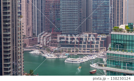 Aerial view of Dubai Marina residential and office skyscrapers with waterfront timelapse 138230124