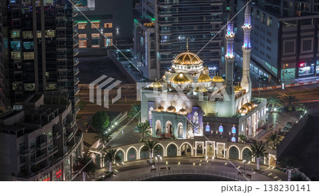Modern residential architecture of Dubai Marina and Mohammed Bin Ahmed Almulla Mosque aerial night timelapse Modern residential architecture of Dubai Marina and Mohammed Bin Ahmed Almulla Mosque aerial night timelapse 138230141