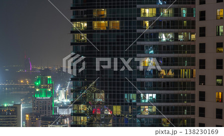 Modern skyscrapers in Jumeirah beach residence in Dubai, JBR aerial night timelapse Modern skyscrapers in Jumeirah beach residence in Dubai, JBR aerial night timelapse 138230169