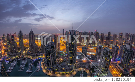 Aerial top view of Dubai Marina night to day timelapse. Modern towers and traffic on the road Aerial top view of Dubai Marina night to day timelapse. Modern towers and traffic on the road 138230194