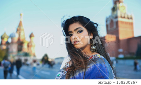 Bangladeshi woman visiting Moscow, blending cultures near city landmarks Bangladeshi woman visiting Moscow, blending cultures near city landmarks 138230267