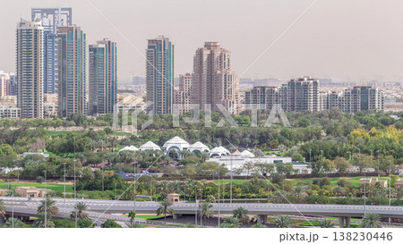 Dubai Golf Course with a cityscape of Greens and tecom districts at the background aerial timelapse Dubai Golf Course with a cityscape of Greens and tecom districts at the background aerial timelapse 138230446