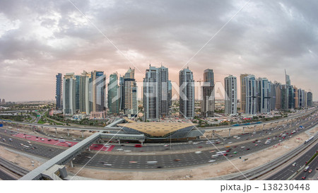 Aerial top view to Sheikh Zayed road near Dubai Marina and JLT day to night timelapse, Dubai. Aerial top view to Sheikh Zayed road near Dubai Marina and JLT day to night timelapse, Dubai. 138230448