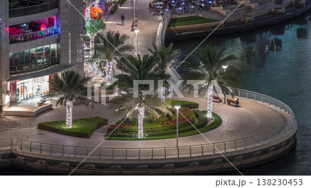 Waterfront promenade in Dubai Marina aerial night timelapse. Dubai, United Arab Emirates Waterfront promenade in Dubai Marina aerial night timelapse. Dubai, United Arab Emirates 138230453