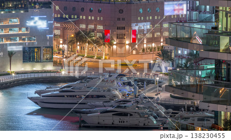 Waterfront promenade in Dubai Marina aerial night timelapse. Dubai, United Arab Emirates Waterfront promenade in Dubai Marina aerial night timelapse. Dubai, United Arab Emirates 138230455