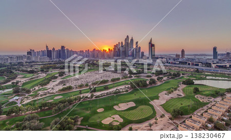 Dubai Marina skyscrapers and golf course sunset timelapse, Dubai, United Arab Emirates 138230467