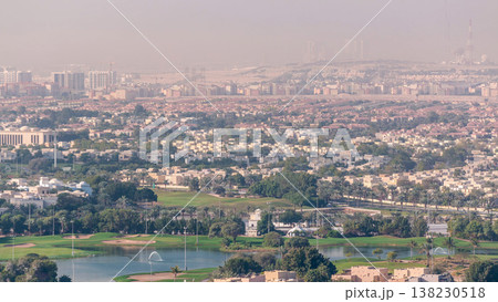 Aerial view to villas and houses with Golf course with green lawn and lakes timelapse 138230518