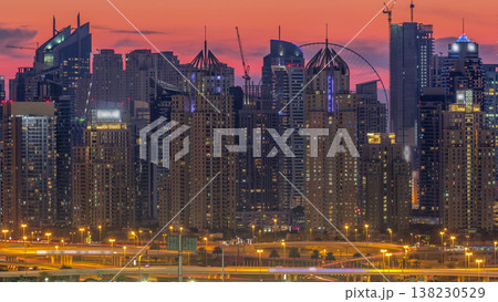 Dubai Marina skyscrapers and golf course day to night timelapse, Dubai, United Arab Emirates Dubai Marina skyscrapers and golf course day to night timelapse, Dubai, United Arab Emirates 138230529