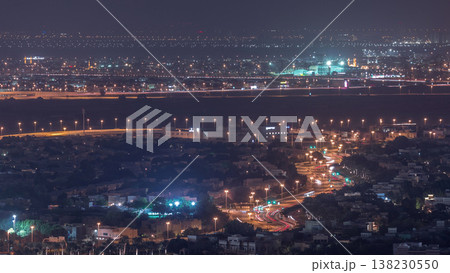 Aerial view of apartment houses and villas in Dubai city night timelapse, United Arab Emirates Aerial view of apartment houses and villas in Dubai city night timelapse, United Arab Emirates 138230550