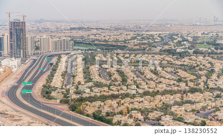 Aerial view of apartment houses and villas in Dubai city timelapse, United Arab Emirates Aerial view of apartment houses and villas in Dubai city timelapse, United Arab Emirates 138230552