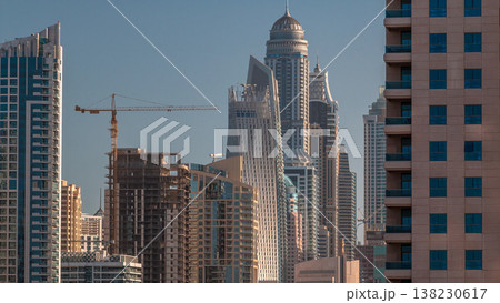 Modern skyscrapers in Dubai Marina early morning during sunrise, close up, in Dubai, UAE Modern skyscrapers in Dubai Marina early morning during sunrise, close up, in Dubai, UAE 138230617