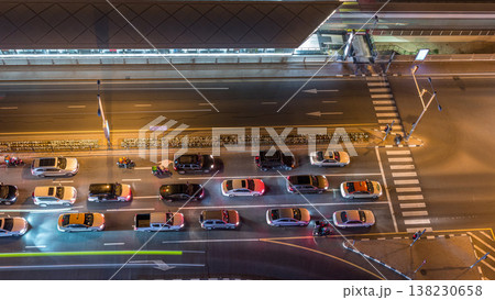 Intersection with cars and tram stop with railway aerial view from above night timelapse in Dubai Marina Intersection with cars and tram stop with railway aerial view from above night timelapse in Dubai Marina 138230658