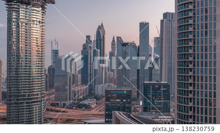 Aerial view of new skyscrapers and tall buildings in Dubai night to day timelapse Aerial view of new skyscrapers and tall buildings in Dubai night to day timelapse 138230759