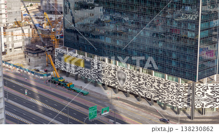 Office buildings in Business Bay with construction site and crane timelapse Office buildings in Business Bay with construction site and crane timelapse 138230862