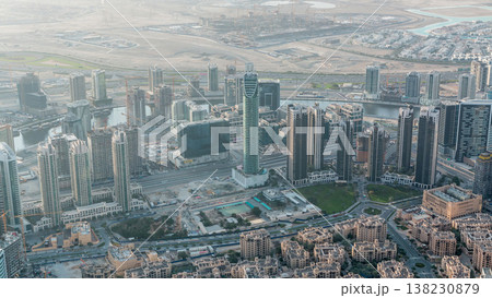 Downtown of Dubai in the morning timelapse after sunrise. Aerial view with towers and skyscrapers Downtown of Dubai in the morning timelapse after sunrise. Aerial view with towers and skyscrapers 138230879