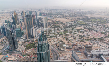 Downtown of Dubai in the morning timelapse after sunrise. Aerial view with towers and skyscrapers 138230880