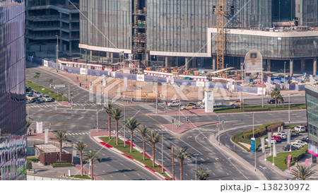 Top view city traffic on a crossroad in Dubai Business bay timelapse. Top view city traffic on a crossroad in Dubai Business bay timelapse. 138230972