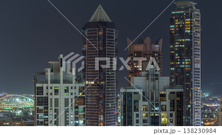 Nighttime view of lights from skyscrapers at evening in Dubai aerial timelapse Nighttime view of lights from skyscrapers at evening in Dubai aerial timelapse 138230984
