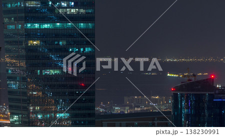 Dubai's business bay towers aerial night timelapse. 138230991
