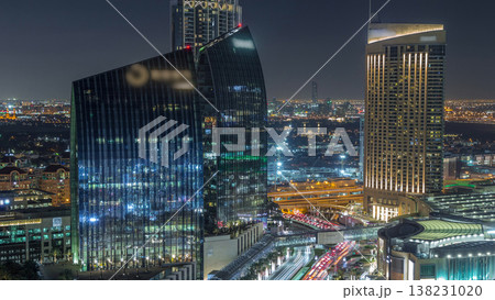 Dubai downtown street with busy traffic and skyscrapers around night timelapse. 138231020