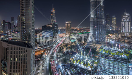 Panoramic skyline view of Dubai downtown with mall, fountains and skyscrapers aerial night timelapse Panoramic skyline view of Dubai downtown with mall, fountains and skyscrapers aerial night timelapse 138231050