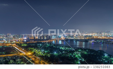 Nighttime rhythm of the city of Dubai near canal aerial timelapse 138231083