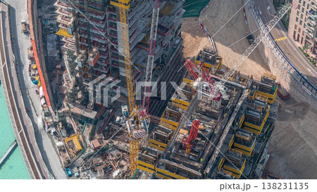 Construction of new modern skyscraper in Dubai city aerial timelapse, United Arab Emirates Construction of new modern skyscraper in Dubai city aerial timelapse, United Arab Emirates 138231135