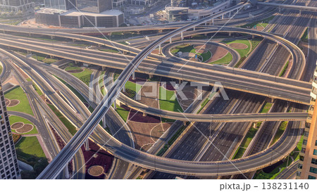 Aerial morning view of highway interchange in Dubai downtown timelapse. 138231140