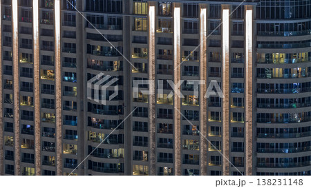 Night view of exterior apartment tower timelapse. High rise skyscraper with blinking lights in windows 138231148