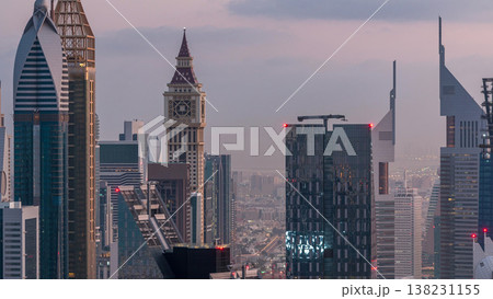 Dubai International Financial Centre district with modern skyscrapers night to day timelapse Dubai International Financial Centre district with modern skyscrapers night to day timelapse 138231155