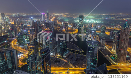 Panoramic aerial view of business bay towers in Dubai day to night timelapse. Panoramic aerial view of business bay towers in Dubai day to night timelapse. 138231169