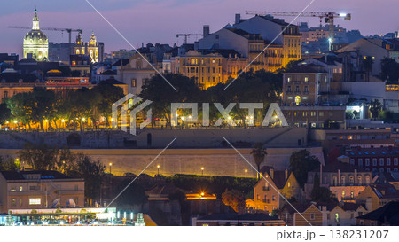 Lisbon panorama after sunset aerial view of city centre with red roofs at autumn day to night timelapse, Portugal Lisbon panorama after sunset aerial view of city centre with red roofs at autumn day to night timelapse, Portugal 138231207