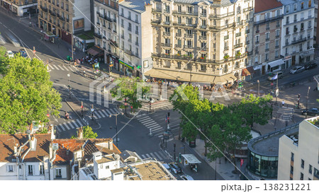 Aerial panorama above many houses rooftops in a Paris timelapse 138231221