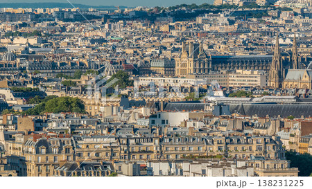 Aerial panorama above many houses rooftops in a Paris timelapse Aerial panorama above many houses rooftops in a Paris timelapse 138231225