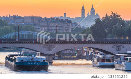 Bridge near Eiffel tower and the Seine river night to day transition timelapse before sunrise, Paris, France. 138231233