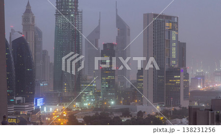 Dubai downtown skyline night to day aerial timelapse with traffic on highway 138231256