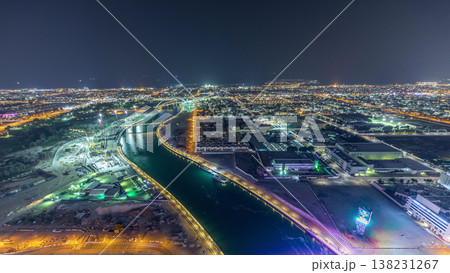 Dubai water canal with footbridge aerial night timelapse from Downtown skyscrapers rooftop Dubai water canal with footbridge aerial night timelapse from Downtown skyscrapers rooftop 138231267
