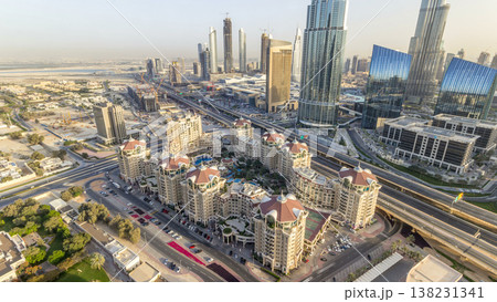 Dubai downtown skyline at sunset timelapse and road traffic near mall, UAE Dubai downtown skyline at sunset timelapse and road traffic near mall, UAE 138231341