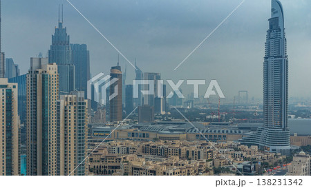 Dubai Downtown night to day timelapse. Aerial view over big futuristic city by night. Dubai Downtown night to day timelapse. Aerial view over big futuristic city by night. 138231342