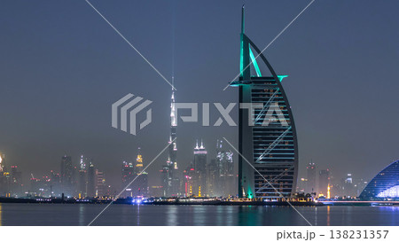 Skyline of Dubai by night with Burj Al Arab from the Palm Jumeirah timelapse. 138231357