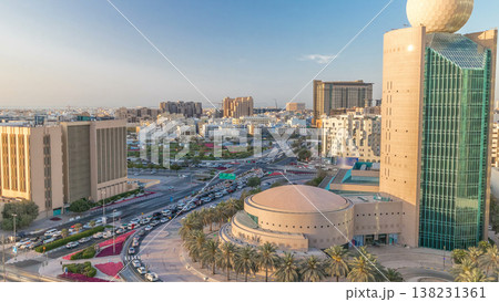 Dubai Creek area surrounded by modern buildings and busy traffic street timelapse Dubai Creek area surrounded by modern buildings and busy traffic street timelapse 138231361