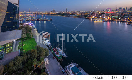 Dubai creek landscape day to night timelapse with boats and ship near waterfront Dubai creek landscape day to night timelapse with boats and ship near waterfront 138231375