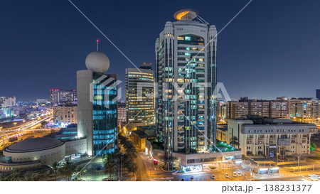 Dubai Creek area surrounded by modern buildings and busy traffic street night timelapse 138231377