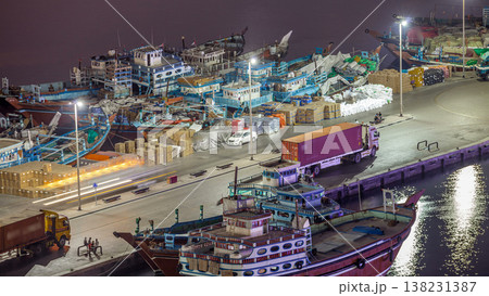 Loading a ship in Port Said night timelapse in Dubai, UAE. 138231387