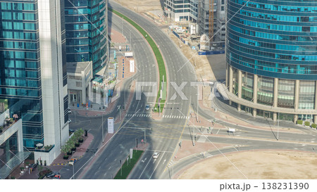 Top view city traffic on a crossroad in Dubai Downtown timelapse. Top view city traffic on a crossroad in Dubai Downtown timelapse. 138231390