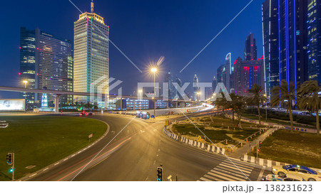 Traffic on intersection and bridge at the Sheikh Zayed Road day to night timelapse 138231623
