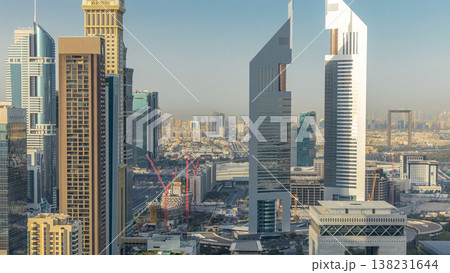 Skyline view of the buildings of Sheikh Zayed Road and DIFC timelapse in Dubai, UAE. Skyline view of the buildings of Sheikh Zayed Road and DIFC timelapse in Dubai, UAE. 138231644