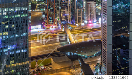 Skyline view of the buildings of Sheikh Zayed Road and DIFC night timelapse in Dubai, UAE. Skyline view of the buildings of Sheikh Zayed Road and DIFC night timelapse in Dubai, UAE. 138231665